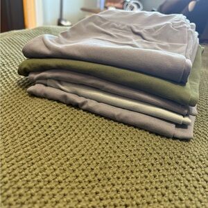 Stack of Gray and Green Shirts